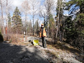 Dr. Melo taking measurements during a time-domain electromagnetic survey in Sudbury region, Canada